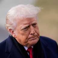US President Donald Trump looks on before departing for Florida from the South Lawn, at the White House in Washington, D.C., U.S., January 16, 2026.