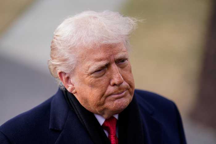 US President Donald Trump looks on before departing for Florida from the South Lawn, at the White House in Washington, D.C., U.S., January 16, 2026.