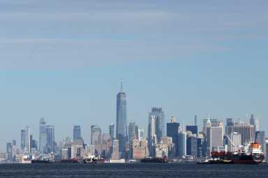 Ships and barges are seen in New York Harbor by One World Trade Center and Lower Manhattan as seen from Staten Island in New York City, U.S., January 16, 2026.
