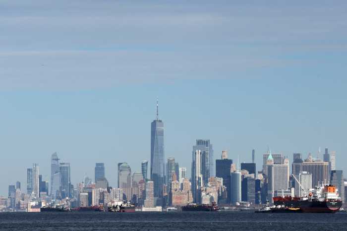 Ships and barges are seen in New York Harbor by One World Trade Center and Lower Manhattan as seen from Staten Island in New York City, U.S., January 16, 2026.