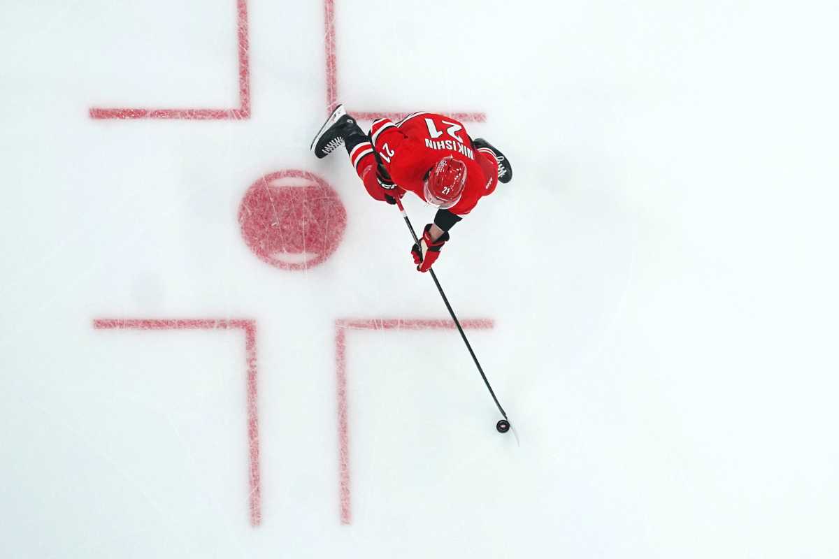 Carolina Hurricanes defenseman Alexander Nikishin (21) skates with the puck against the Chicago Blackhawks first period at Lenovo Center. Mandatory Credit: