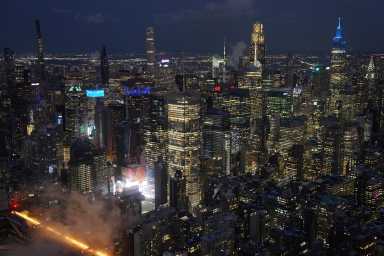 The Midtown Manhattan skyline, as seen from an observation deck at the Edge at Hudson Yards, in New York City, U.S., January 27, 2026. Picture taken through glass.