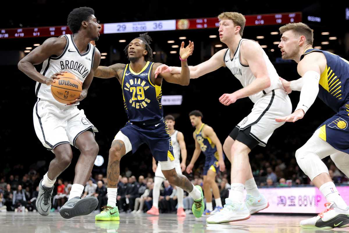 Feb 11, 2026; Brooklyn, New York, USA; Brooklyn Nets guard Drake Powell (4) looks to pass the ball against Indiana Pacers guard Quenton Jackson (29) and center Micah Potter (11) during the second quarter at Barclays Center.