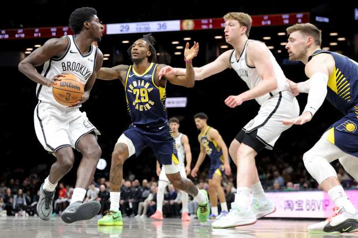 Feb 11, 2026; Brooklyn, New York, USA; Brooklyn Nets guard Drake Powell (4) looks to pass the ball against Indiana Pacers guard Quenton Jackson (29) and center Micah Potter (11) during the second quarter at Barclays Center.