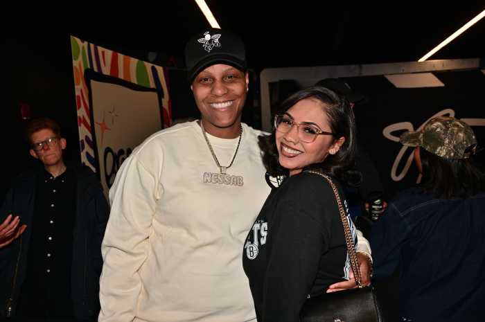 Sharing a moment together near the Pride Night photo booth.