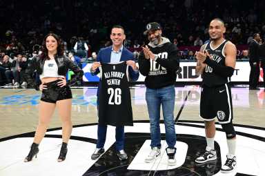 Jackie Wilson, Brooklyn Sports & Entertainment’s SVP of Social Impact (middle right) presents the Jason Collins award to the Ali Forney Center, led by president and executive director Alex Roque (middle left) during halftime of the Nets-Mavericks Pride Night game on Feb. 24.