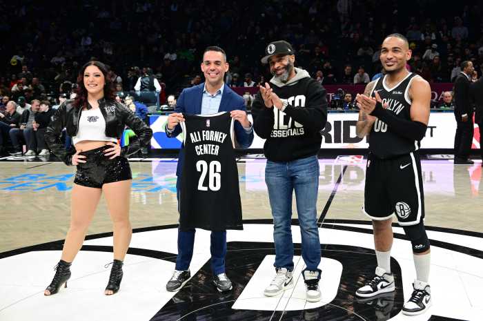 Jackie Wilson, Brooklyn Sports & Entertainment’s SVP of Social Impact (middle right) presents the Jason Collins award to the Ali Forney Center, led by president and executive director Alex Roque (middle left) during halftime of the Nets-Mavericks Pride Night game on Feb. 24.