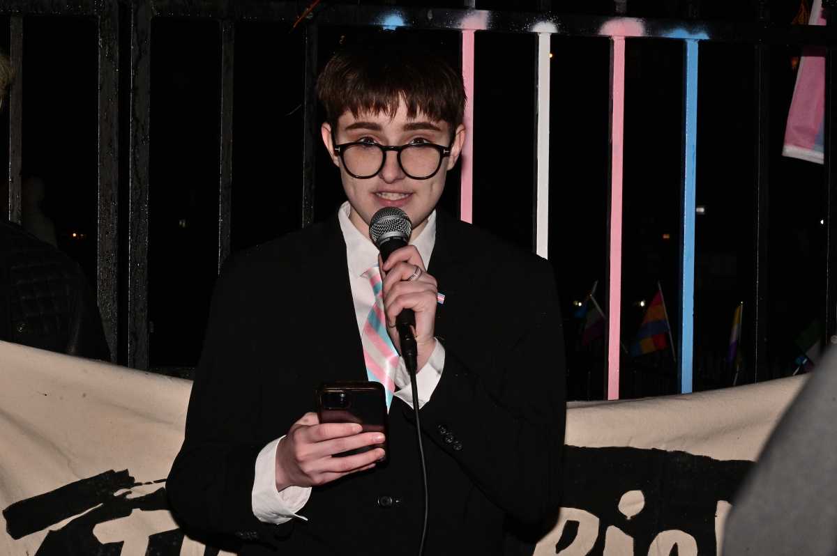 Lorelei Crean speaks at a rally near Stonewall after NYU Langone shut down a gender-affirming care program for trans youth.