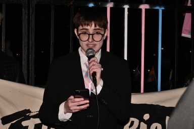 Lorelei Crean speaks at a rally near Stonewall after NYU Langone shut down a gender-affirming care program for trans youth.