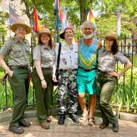 Steven Love Menendez (second from right) with Randy Wicker (center) and park rangers in front of the flagpole at the Stonewall National Monument in 2022 — during the Biden administration.