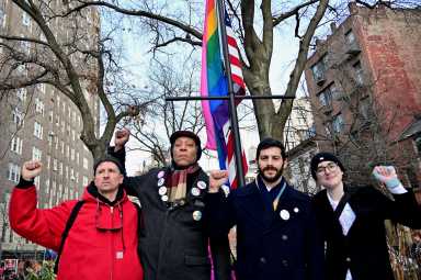 Activists stand in front of the Rainbow Flag after re-installing it at the Stonewall National Monument on Feb. 12. From left to right: Josh Tjaden, Jay W. Walker, Assemblymember Alex Bores, and Lorelei Crean.