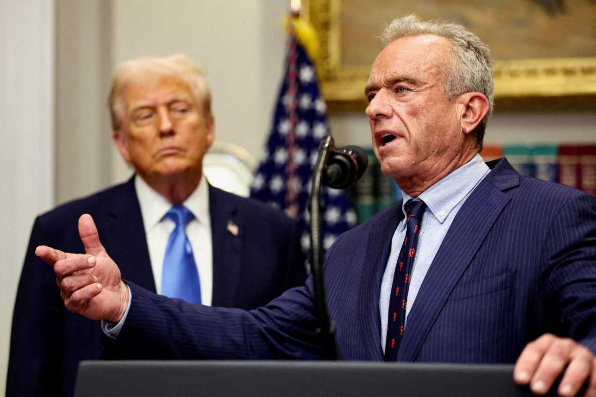 U.S. Secretary of Health and Human Services Robert F. Kennedy Jr. delivers remarks while U.S. President Donald Trump listens during a press conference at the White House in Washington, D.C., U.S., September 22, 2025.
