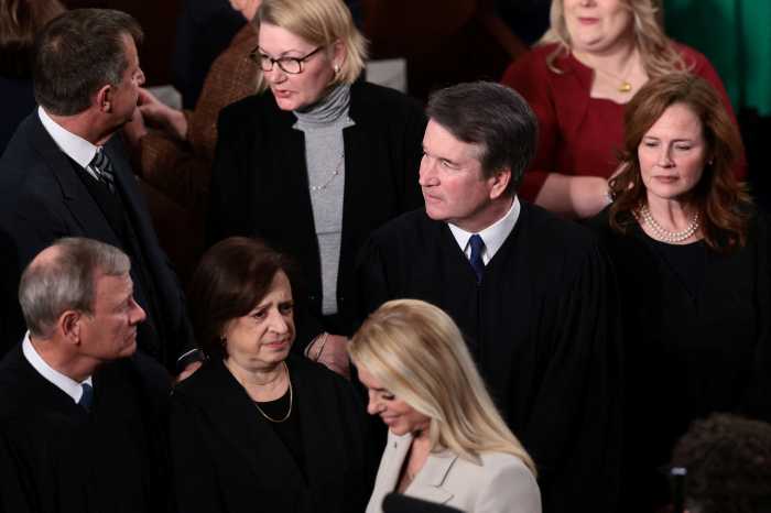 U.S. Attorney General Pam Bondi walks past Chief Justice of the U.S. Supreme Court John Roberts, U.S. Supreme Court Justice Elena Kagan, U.S. Supreme Court Justice Brett M. Kavanaugh and U.S. Supreme Court Justice Amy Coney Barrett before U.S. President Donald Trump delivers the State of the Union address to a joint session of Congress at the U.S. Capitol in Washington, D.C., U.S., February 24, 2026. 