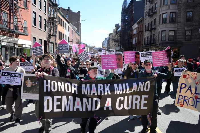 ACT UP members march through Manhattan on March 21 to mark the organization's 39th anniversary and honor the life of Mark Milano.