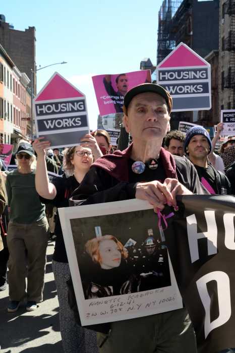 Jim Eigo carries the banner during ACT UP's March 21 demonstration.
