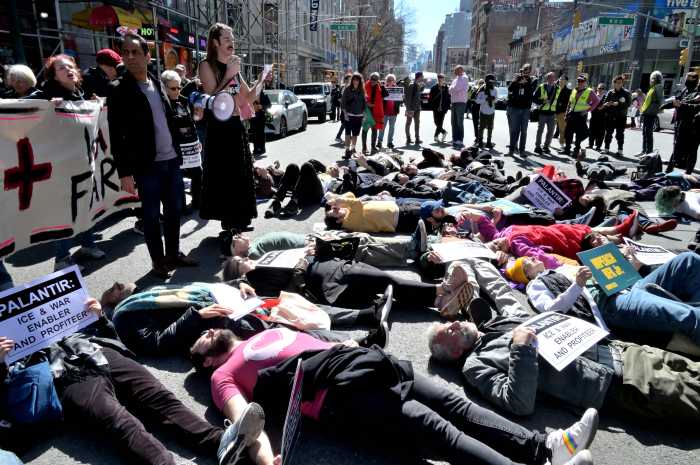 Members of ACT UP participate in a die-in near Palantir's Manhattan office.