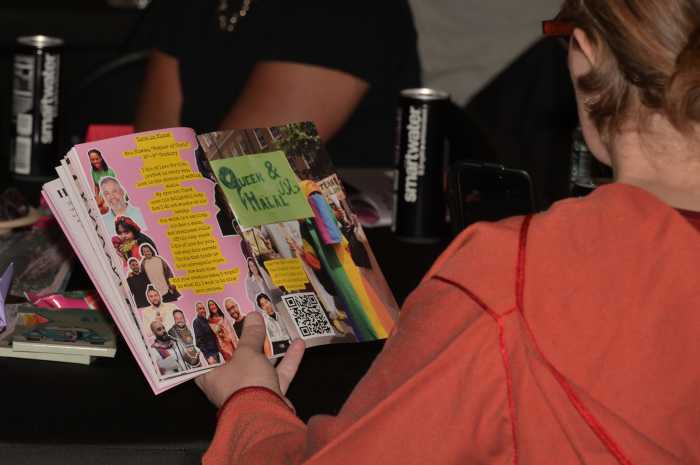 Community members browse books during the 10th annual Iftar.