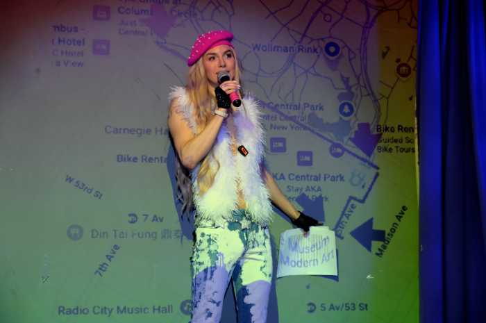 Organizer Ashley Ryan, speaking at Red Eye NY, outlines the route and discusses safety guidelines ahead of the march.