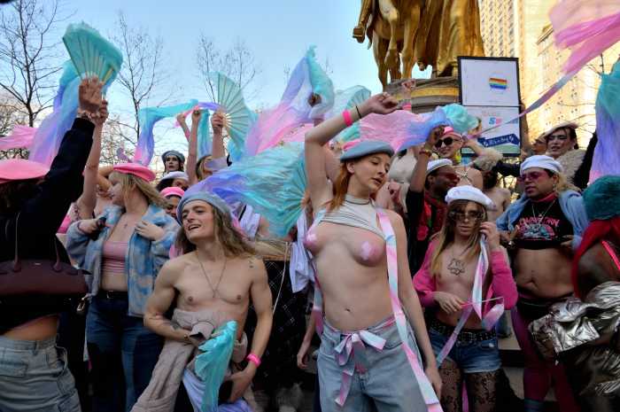Dancing at the fountain on Fifth Avenue.