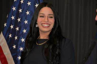 Taylor Brown, the first director of the new Mayor's Office of LGBTQIA+ Affairs, looks on during a press conference on March 13.