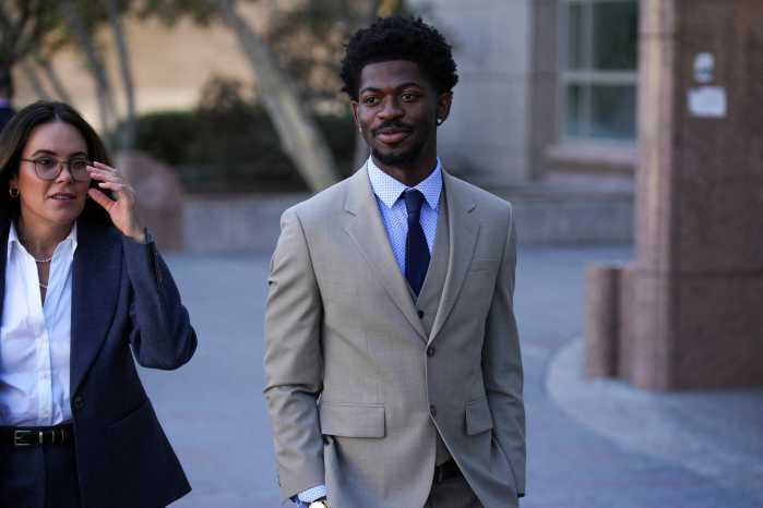 Grammy-winning musician Lil Nas X leaves court after a preliminary hearing on four felony charges for allegedly assaulting and resisting police officers responding to an incident in August when police approached him while he was reportedly walking nearly naked on the streets of Los Angeles, in Van Nuys, Los Angeles, California, U.S. March 12, 2026.