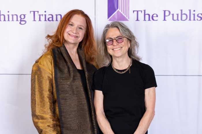 Karen Finley (left) presented the Michele Karlsberg Leadership Award to Amy Scholder.