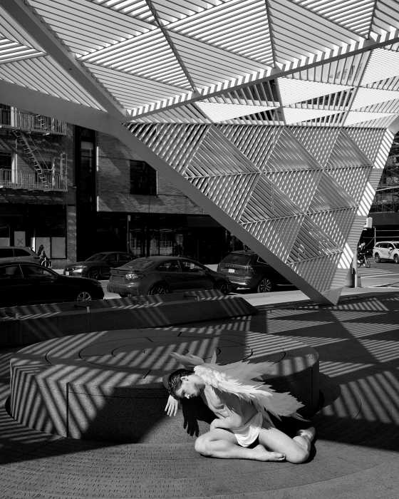 An angel leans against the fountain at the NYC AIDS Memorial.