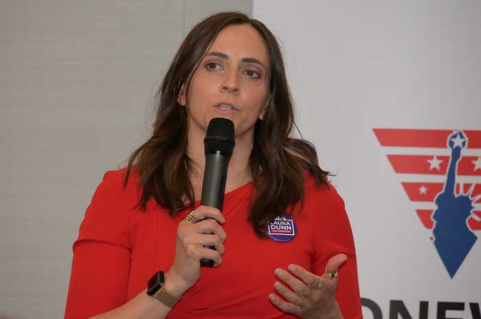 Congressional candidate Laura Dunn delivers remarks to Stonewall's members.