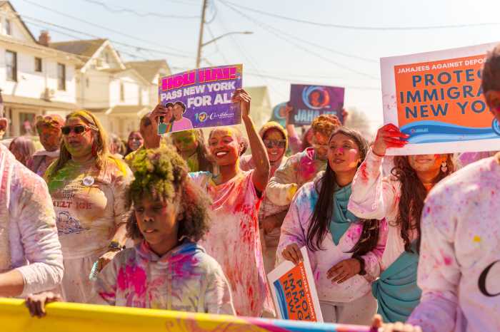 Marchers show their support for the New York for All Act.