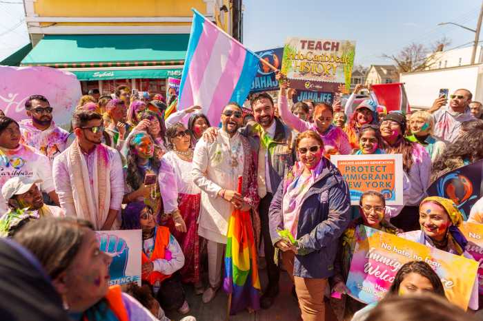Mayor Zohran Mamdani stops for a picture with the Caribbean Equality Project.
