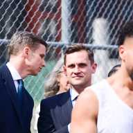 State Senator Erik Bottcher speaks with his former chief of staff, City Council candidate Carl Wilson, at an April 17 artist housing rally in Hell’s Kitchen.