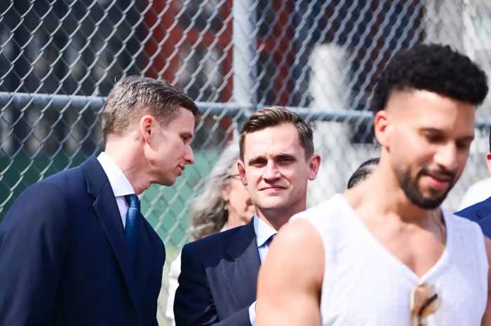 State Senator Erik Bottcher speaks with his former chief of staff, City Council candidate Carl Wilson, at an April 17 artist housing rally in Hell’s Kitchen.