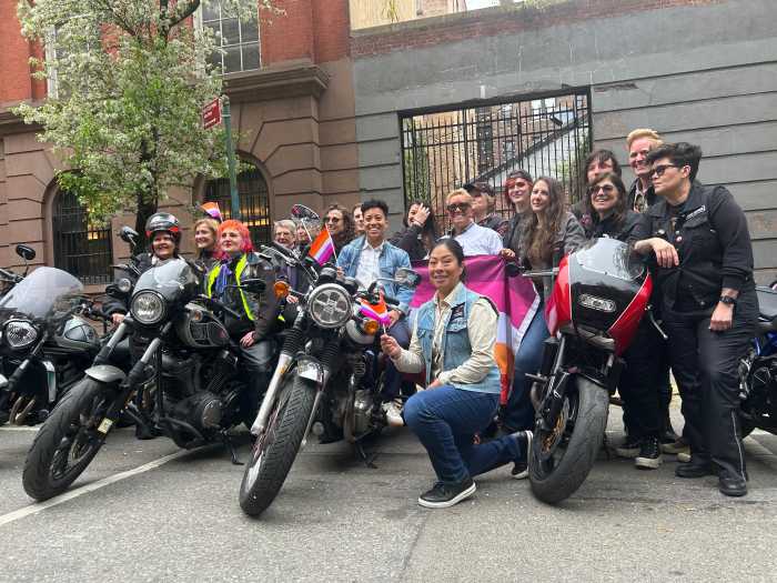 Bikers take a group picture with Brooklyn Councilmember Crystal Hudson.