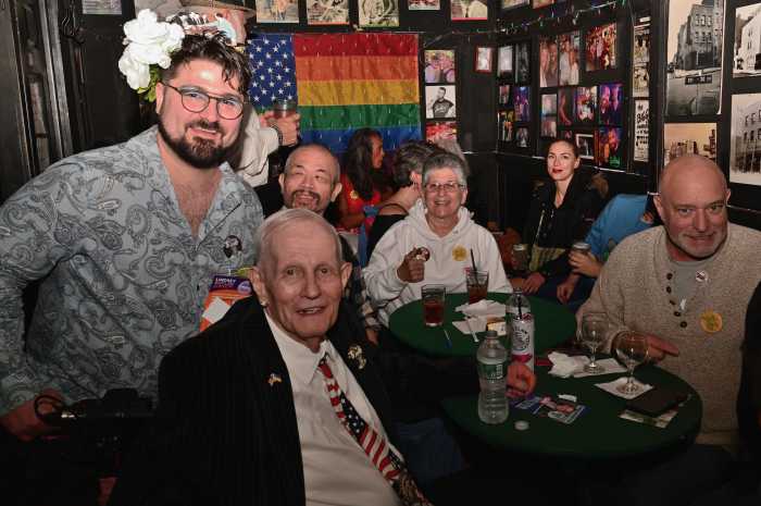 Randy Wicker shares a moment with patrons at Julius' Bar.