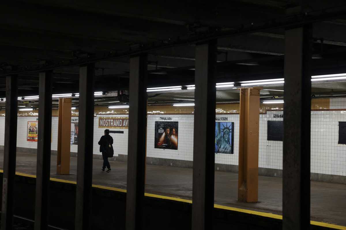 A woman walks on the subway platform in the Bedford–Stuyvesant neighborhood in the Brooklyn borough of New York City, U.S., April 23, 2026.