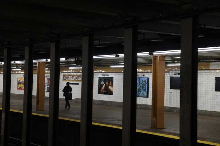 A woman walks on the subway platform in the Bedford–Stuyvesant neighborhood in the Brooklyn borough of New York City, U.S., April 23, 2026.