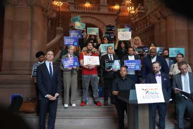 New Pride Agenda executive director Kei Williams delivers remars in the State Capitol on May 6, 2026.