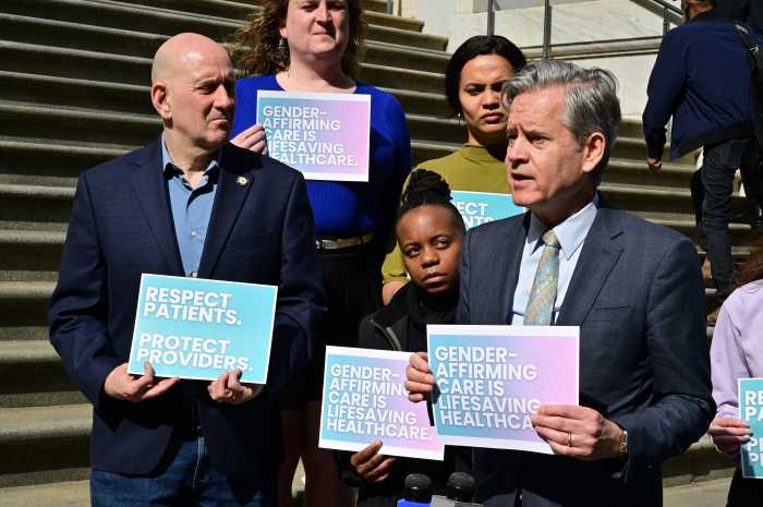 Manhattan Borough President Brad Hoylman-Sigal (right) speaks alongside Councilmember Harvey Epstein.