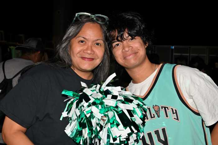 Carmelyn Malalais and her son enjoy the game.