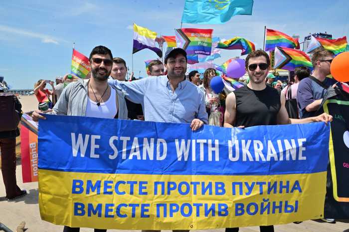 Adam Eli (center), a longtime supporter of Brighton Beach Pride, delivered remarks at the post-march rally.