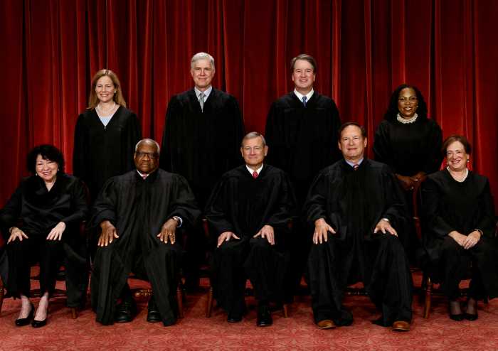 U.S. Supreme Court justices pose for their group portrait at the Supreme Court in Washington, U.S., October 7, 2022. Seated (L-R): Justices Sonia Sotomayor, Clarence Thomas, Chief Justice John G. Roberts, Jr., Samuel A. Alito, Jr. and Elena Kagan. Standing (L-R): Justices Amy Coney Barrett, Neil M. Gorsuch, Brett M. Kavanaugh and Ketanji Brown Jackson. 