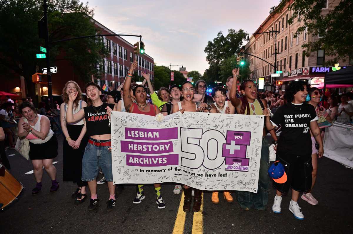 The Lesbian Herstory Archives contingent marches along Fifth Avenue during Brooklyn Pride's twilight march on June 13.