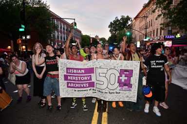The Lesbian Herstory Archives contingent marches along Fifth Avenue during Brooklyn Pride's twilight march on June 13.