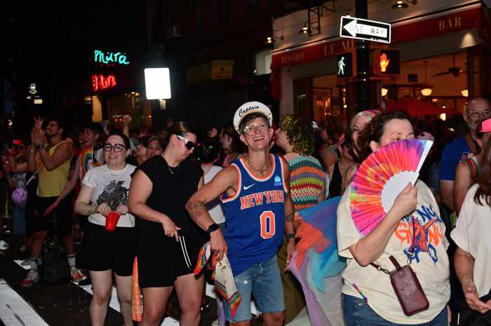 Crowds spill out into the street for Brooklyn Pride.