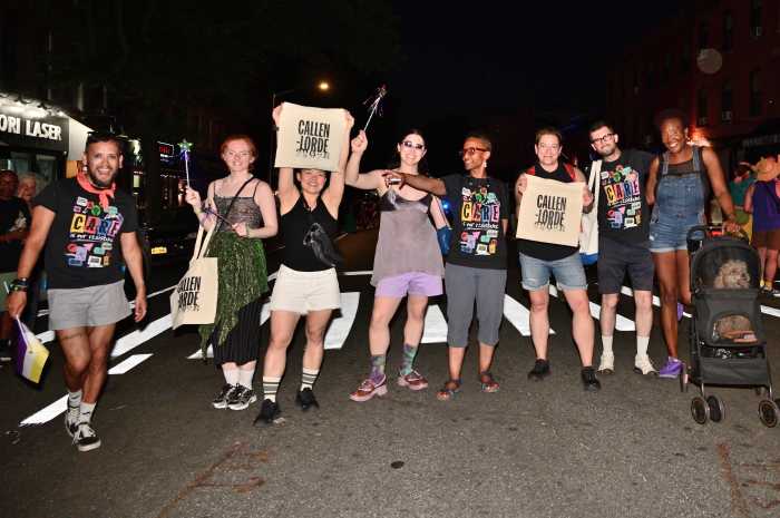 The Callen-Lorde team shows off their tote bags.