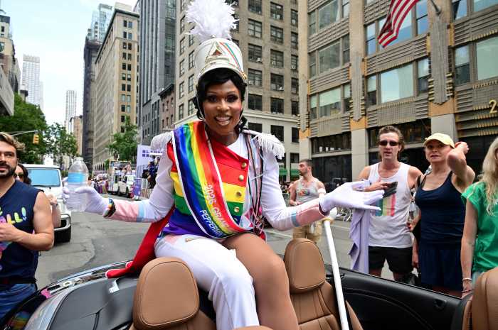Peppermint, one of this year's grand marshals, rides in style.