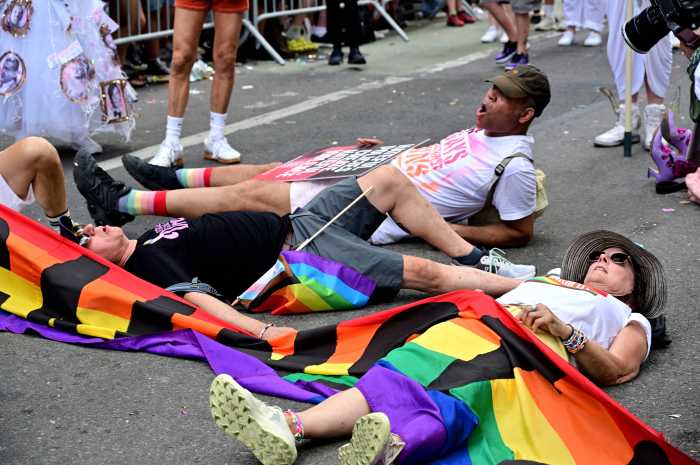 Participating in a die-in.