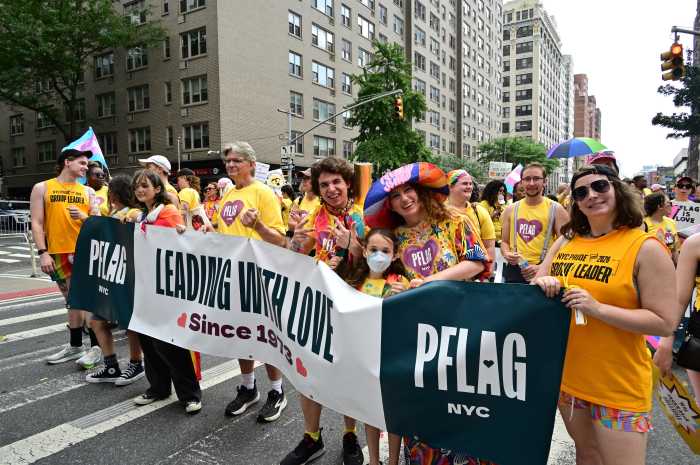 The PFLAG team joins together for Pride.