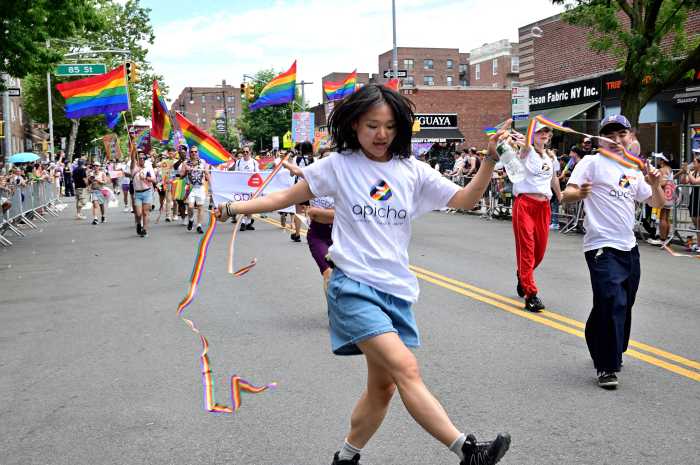 The Apicha Community Health Center contingent marches along.