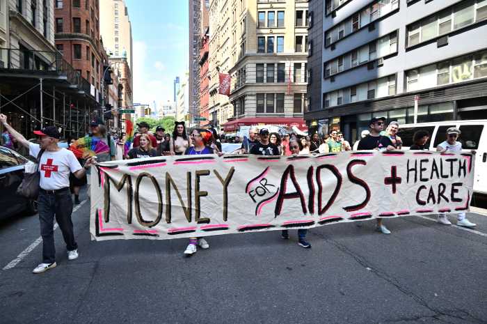 Marchers demand necessary funding for HIV/AIDS and healthcare.